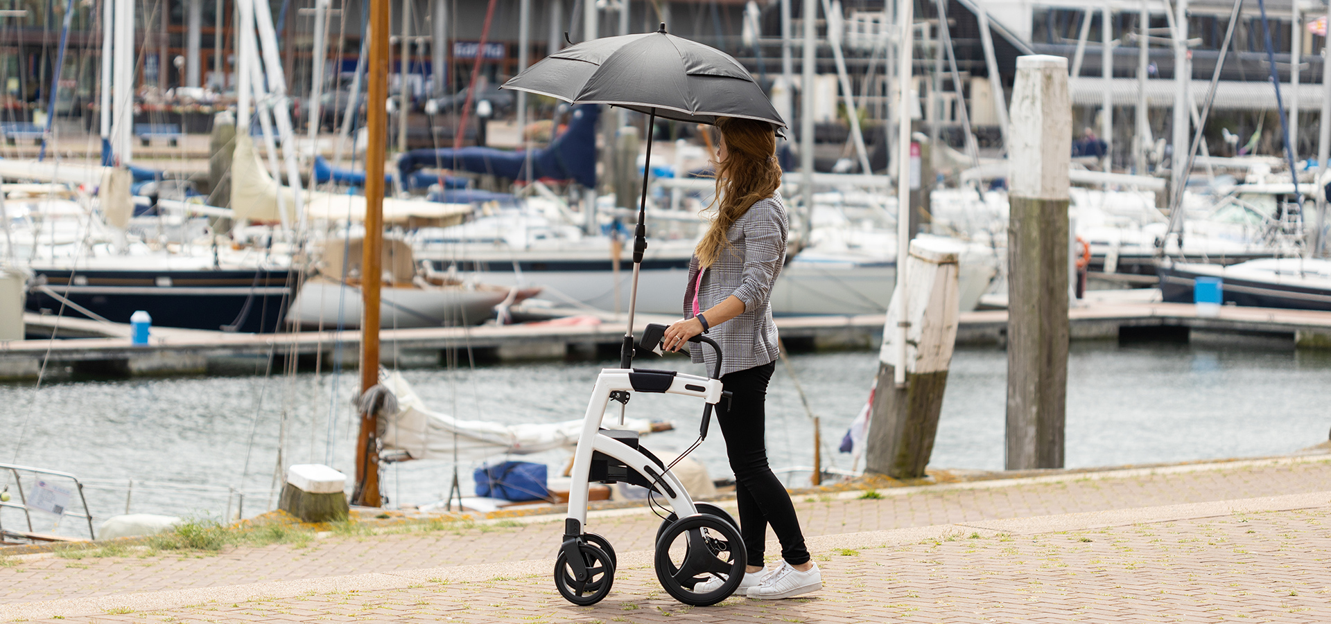 Walking upright with a Rollz Motion stable rollator and umbrella